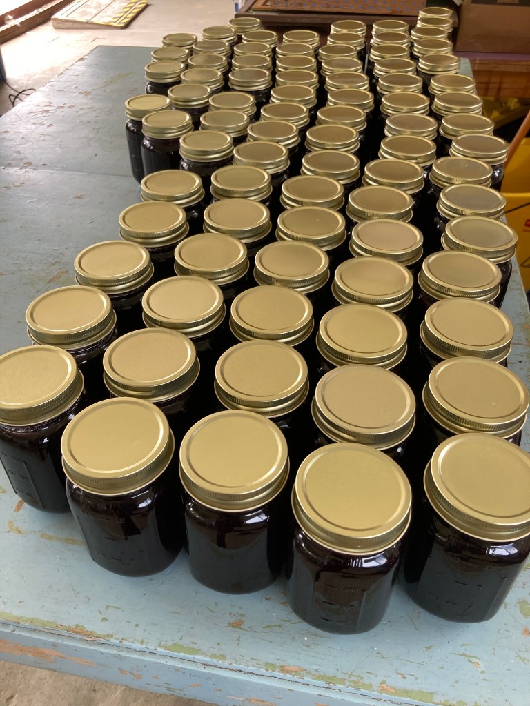 A table covered in jars of jam